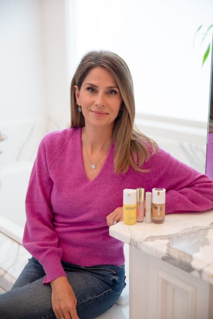 Lauren Freeman Roth sitting down with makeup products